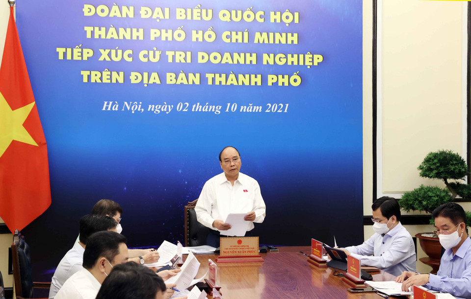 Chủ tịch nước Nguyễn Xuân Phúc và các đại biểu tại điểm cầu Hà Nội. (Ảnh: Thống Nhất/TTXVN)