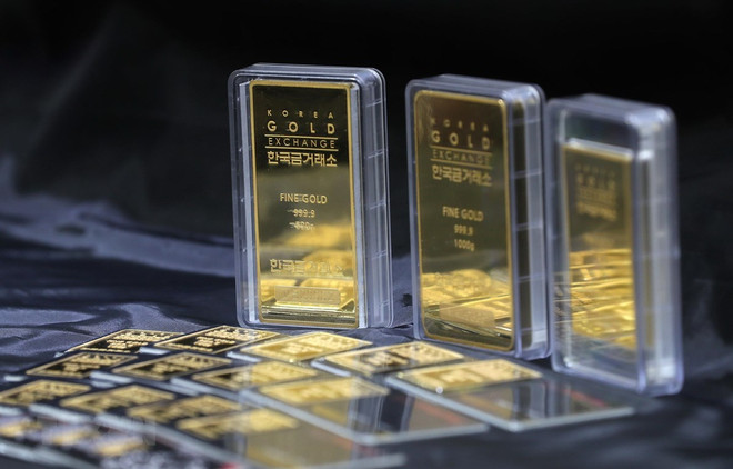 Giá vàng châu Á đi xuống phiên giao dịch đầu tuần 23/3 ảnh 1