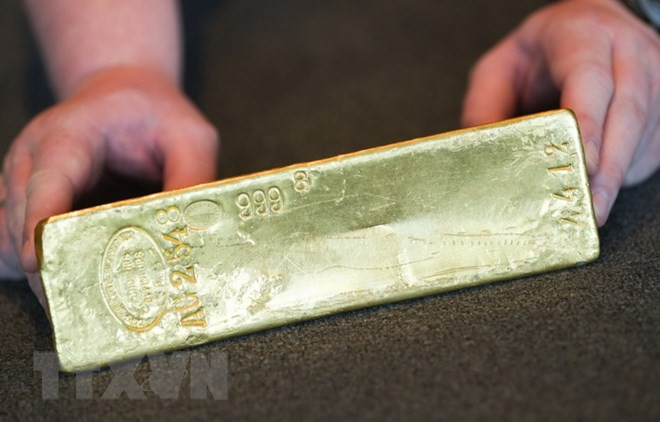 Giá vàng thế giới giảm trước sự mạnh lên của đồng USD ảnh 1