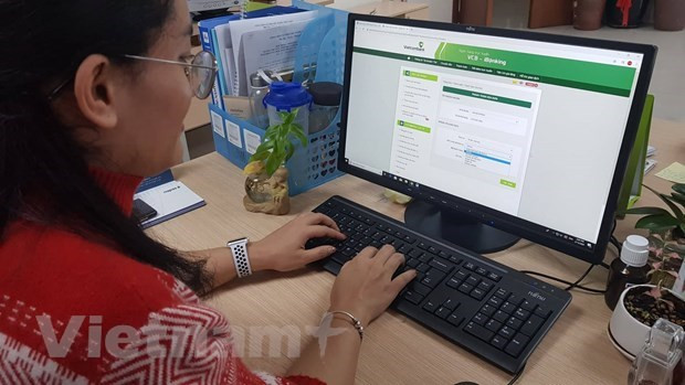 Ảnh minh họa. (Ảnh: PV/Vietnam+) Tiếp tục đề xuất giảm giá cước tin nhắn dịch vụ tài chính, ngân hàng ảnh 1