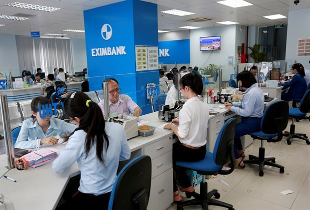 Giao dịch tại Eximbank. (Ảnh: CTV/Vietnam+) Bán 133 triệu cổ phiếu, SMBC không còn là cổ đông lớn tại Eximbank ảnh 1