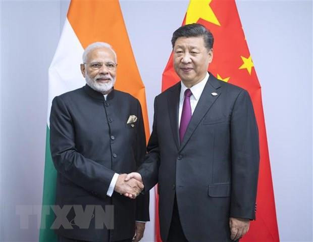 Thủ tướng Ấn Độ Narendra Modi (trái) và Chủ tịch Trung Quốc Tập Cận Bình (phải) tại một cuộc gặp. (Nguồn: THX/TTXVN) Lãnh đạo Ấn Độ-Trung Quốc hội đàm bên lề SCO tại Kyrgyzstan ảnh 1