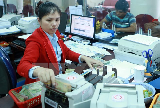 Ảnh minh họa. (Nguồn: TTXVN) Quy định về giới hạn sở hữu cổ phần của tổ chức tín dụng ảnh 1
