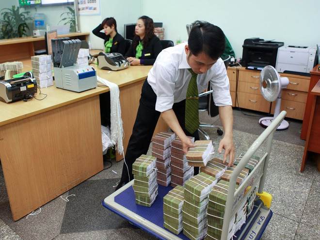 Ngân hàng Nhà nước yêu cầu tổ chức tín dụng tăng cường xử lý nợ xấu ảnh 1