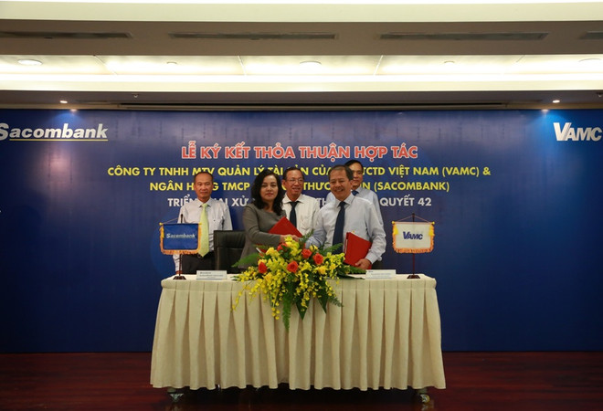 Sacombank hợp tác với VAMC xử lý và thu hồi 20.000 tỷ đồng nợ xấu ảnh 1