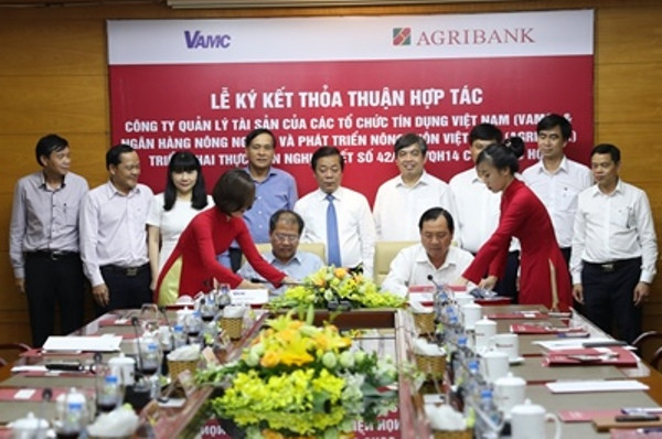 Agribank và VAMC ký kết thỏa thuận hợp tác về xử lý nợ xấu ảnh 1