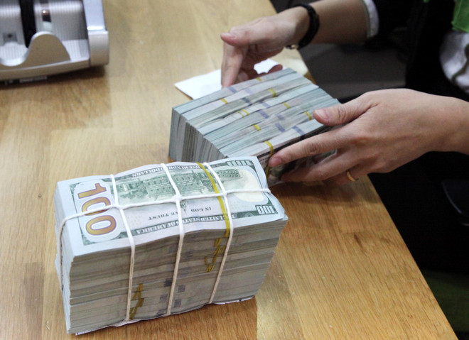 Ảnh minh họa. (Nguồn: Vietnam+) Tỷ giá USD tại các ngân hàng thương mại cổ phần giảm mạnh ảnh 1