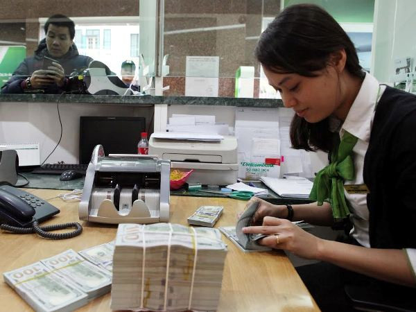 Ảnh minh họa. (Ảnh: Vietnam+) Ngân hàng HSBC dự báo tỷ giá sẽ giảm vào cuối năm 2021 ảnh 1