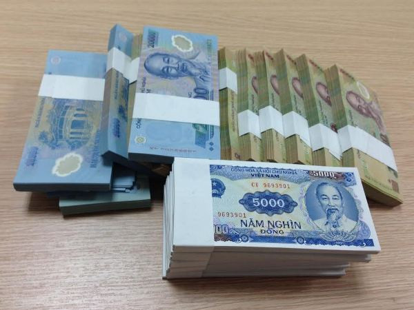 Tiếp tục không in tiển mệnh giá nhỏ dịp Tết. (Ảnh: Vietnam+) Ngân hàng Nhà nước: Tiếp tục không in tiền lẻ mới dịp Tết Tân Sửu ảnh 1