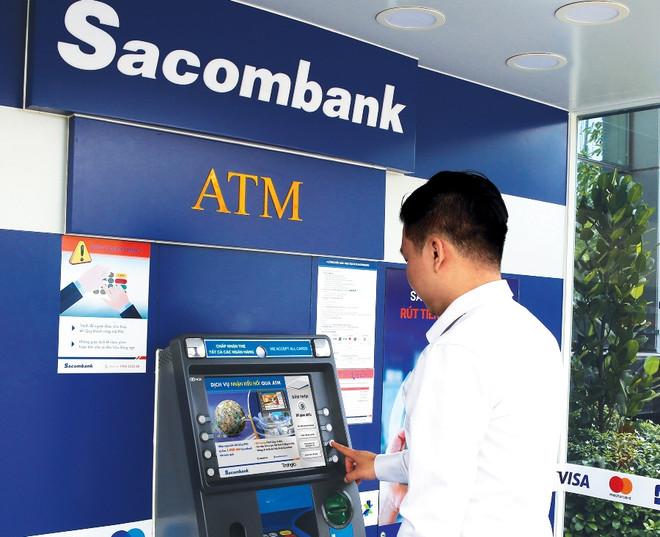 Khách hàng nhận kiều hối miễn phí tại các cây ATM của Sacombank ảnh 1