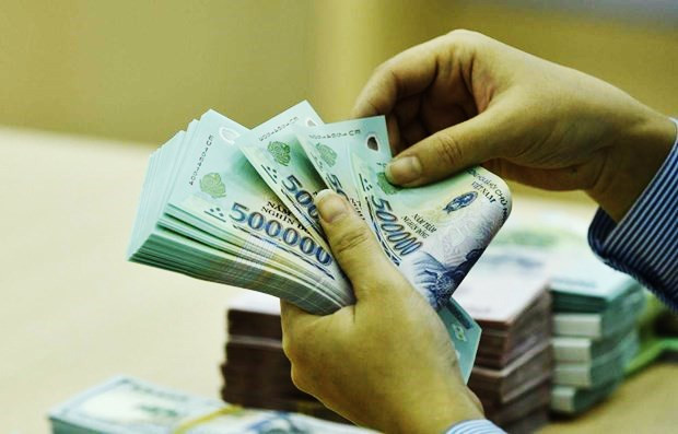 Ngân hàng Nhà nước sẽ tiếp tục phối hợp với các bộ, ngành để khẩn trương triển khai quyết liệt đề án cơ cấu lại hệ thống các tổ chức tín dụng gắn với xử lý nợ xấu. (Ảnh: PV/Vietnam+) Cơ quan quản lý đang tìm nhà đầu tư tham gia cơ cấu lại ngân hàng SCB ảnh 3