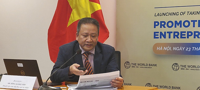 Ông Đặng Quang Vinh, chuyên gia cao cấp khu vực tư nhân của WB chia sẻ tại họp báo. (Ảnh: Vietnam+) 85843196-4331-484e-986c-a0c39eb54d6a.jpg