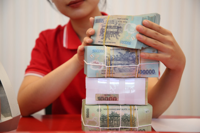 Ngân hàng Nhà nước sẽ duy trì ổn định thị trường tiền tệ. (Ảnh: Vietnam+) Anh So Giao Dịch T8 2023 (33).JPG