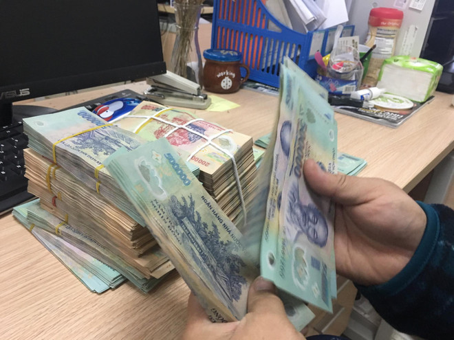Sở hữu chéo trong các tổ chức tín dụng đã giảm. (Ảnh: PV/Vietnam+) Thống đốc báo cáo Quốc hội về tái cơ cấu ngân hàng và sở hữu chéo ảnh 3