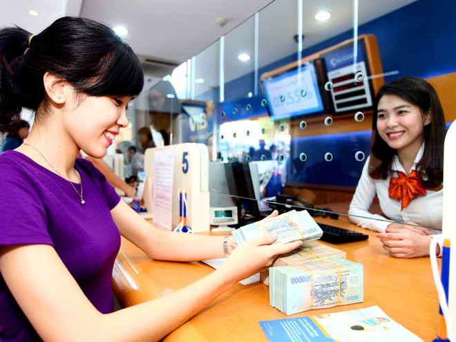 Ảnh minh họa. (Ảnh: CTV/Vietnam+) Quy định mới về áp dụng lãi suất rút tiền gửi trước hạn ảnh 1