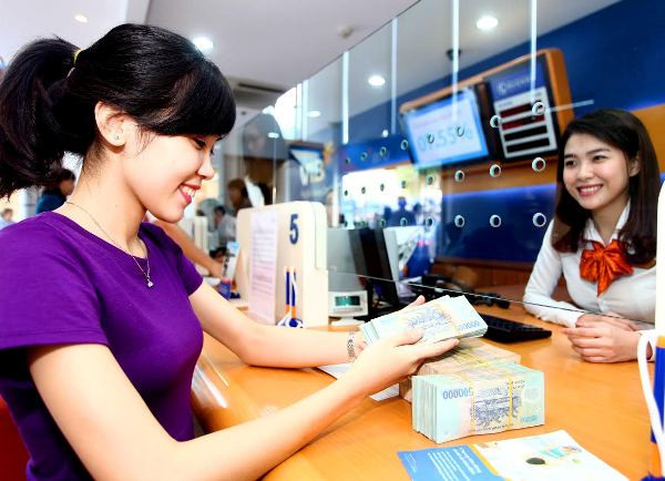 Ảnh minh họa. (Ảnh: CTV/Vietnam+) COVID-19: Các ngân hàng được quyền chủ động cơ cấu lại nợ ảnh 1