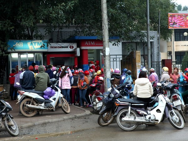 Liệu năm nay có tái diễn cảnh xếp hàng dài rút tiền tại cây ATM? ảnh 1