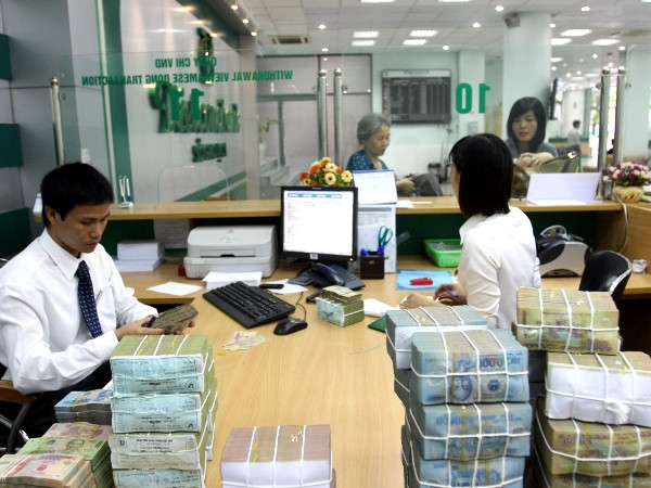 Ảnh minh họa. (Nguồn: TTXVN) Thống đốc NHNN: Năm 2015 sẽ không điều chỉnh tỷ giá quá 2% ảnh 2