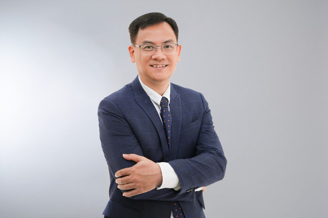 Ông Đinh Đức Quang - Giám đốc điều hành Khối kinh doanh tiền tệ, Ngân hàng UOB Việt Nam. (Ảnh: Vietnam+) Mr Dinh Duc Quang.jpeg