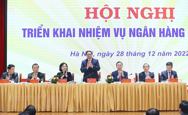 Thủ tướng Chính phủ Phạm Minh Chính tham dự Hội nghị triển khai nhiệm vụ của ngành ngân hàng năm 2023. (Ảnh: Dương Giang/TTXVN) Nhiều ngân hàng kiến nghị tăng vốn và sửa đổi gói hỗ trợ 2% ảnh 1