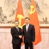 Trưởng Ban Nội chính Trung ương Lê Minh Trí (trái) và Bí thư Ủy ban Chính pháp Trung ương Đảng Cộng sản Trung Quốc Trần Văn Thanh. (Ảnh: Công Tuyên/TTXVN)