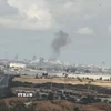 Khói bốc lên từ sân bay quốc tế Ben Gurion ở Tel Aviv, Israel sau vụ tấn công bằng tên lửa của Houthi ngày 4/5/2025. (Ảnh: IRNA/TTXVN)