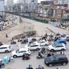 Giao thông tại khu vực nút giao La Thành-Nguyễn Chí Thanh trong ngày đầu phân luồng phục vụ thi công hạng mục cầu vượt thuộc dự án xây dựng đường Vành đai 1, đoạn Hoàng Cầu-Voi Phục. (Ảnh: Quốc Khánh/TTXVN)