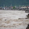 Nước sông dâng cao tại Trung Quốc. (Ảnh: THX/TTXVN)