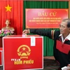 Cử tri bỏ phiếu tại Khu vực bỏ phiếu số 25, xã Hòa Phú, tỉnh Đắk Lắk. (Ảnh: Tuấn Anh/TTXVN)