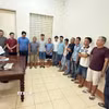 Các đối tượng tại cơ quan Công an. (Ảnh: TTXVN phát)