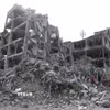 Những ngôi nhà bị phá hủy sau cuộc không kích tại Tehran, Iran. (Ảnh: THX/TTXVN)
