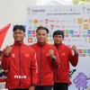 Nụ cười chiến thắng của 3 vận động viên Võ Huỳnh Anh Khoa (giữa), Hán Quang Thoại (phải) và Hồ Văn Đao (trái). (Ảnh: Đỗ Sinh/TTXVN)