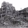 Tòa nhà bị phá hủy sau vụ không kích xuống Tehran, Iran ngày 12/3. (Ảnh: THX/TTXVN)