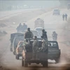Các thành viên thuộc các nhóm vũ trang tiến về miền bắc Syria ngày 6/12/2024. (Ảnh minh họa. AA/TTXVN)