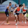 Các vận động viên đội tuyển điền kinh Việt Nam thi đấu xuất sắc nội dung hỗn hợp nam nữ 4x400m để giành Huy chương Vàng SEAGames 33. (Ảnh: Minh Quyết/TTXVN)
