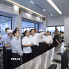 Bí thư Thành ủy Hà Nội Trần Đức Thắng kiểm tra Nhà máy điện rác Seraphin - Khu xử lý chất thải rắn Xuân Sơn. (Ảnh: Văn Điệp/TTXVN)