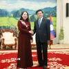 Tổng Bí thư, Chủ tịch nước Lào Thongloun Sisoulith (phải) tiếp Phó Chủ tịch nước Việt Nam Võ Thị Ánh Xuân sang thăm chính thức Lào. (Ảnh: Xuân Tú/TTXVN)