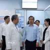 Lãnh đạo Thành ủy Thành phố Hồ Chí Minh, Sở Y tế khảo sát thực tế việc tiếp nhận, sử dụng trụ sở dôi dư của Bệnh viện Tai Mũi Họng. (Ảnh: Đinh Hằng/TTXVN)