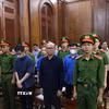 Các bị cáo tại phiên tòa. (Ảnh: Hồng Đạt/TTXVN)