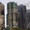 Các tòa chung cư ở khu phức hợp Wang Fuk Court thuộc quận Tai Po, Hong Kong (Trung Quốc) bị thiêu rụi trong vụ hỏa hoạn kéo dài hơn 40 giờ, ngày 27/11/2025. (Ảnh: THX/TTXVN)
