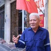 Ông Trần Văn An, Tổ trưởng Tổ dân phố Vị Hoàng 1, phường Nam Định, luôn dành trọn niềm tin tuyệt đối vào sự lãnh đạo của Đảng. (Ảnh: Công Luật/TTXVN)