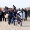 Người tị nạn Palestine trở về nhà tại miền Bắc Dải Gaza ngày 28/1/2025. (Ảnh: THX/TTXVN)