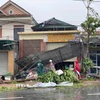 Mái tôn của nhiều hộ dân tại xã Nghi Xuân bị bão làm đổ sập. (Ảnh: Hữu Quyết/TTXVN)