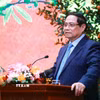 Thủ tướng Phạm Minh Chính đến thăm, chúc mừng năm mới và làm việc với Bộ Văn hóa, Thể thao và Du lịch. (Ảnh: Dương Giang/TTXVN)