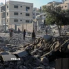 Tòa nhà bị phá hủy trong xung đột tại phía Tây thành phố Gaza. (Ảnh: THX/TTXVN)