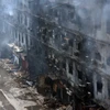 Hiện trường vụ cháy trung tâm thương mại ở Karachi, Pakistan, ngày 19/1/2026. (Ảnh: THX/TTXVN)