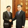 Phó Thủ tướng Trần Hồng Hà (trái) hội kiến Phó Ủy viên trưởng Nhân đại toàn quốc Trung Quốc Vương Đông Minh. (Ảnh: Công Tuyên/TTXVN)