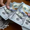 Đồng USD. (Ảnh: AFP/TTXVN)