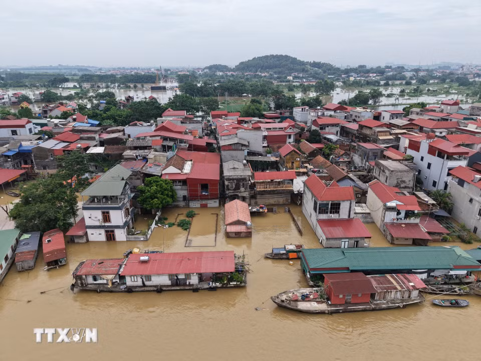 Nước sông dâng cao ngập nhà dân gần 2m. (Ảnh: Thanh Thương/TTXVN)