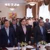 Các đại biểu làm lễ chào cờ tại Đại hội. (Ảnh: TTXVN)